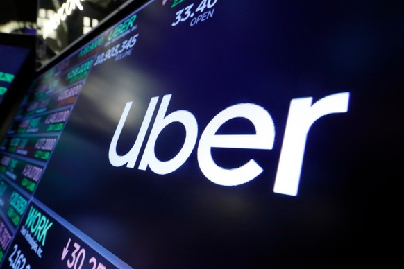 FILE - The Uber logo appears above a trading post on the floor of the New York Stock Exchange, Aug. 16, 2019. (AP Photo/Richard Drew, File)
Uber Sexual Assault Verdict