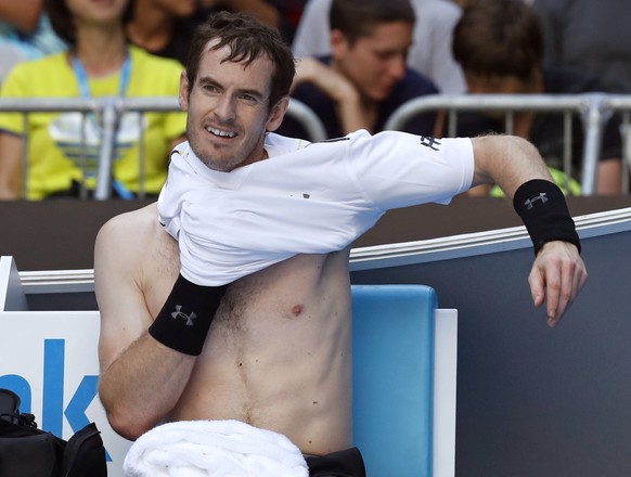 Britain&#039;s Andy Murray changes his shirt during a break while playing United States&#039; Sam Querrey in their third round match at the Australian Open tennis championships in Melbourne, Australia ...