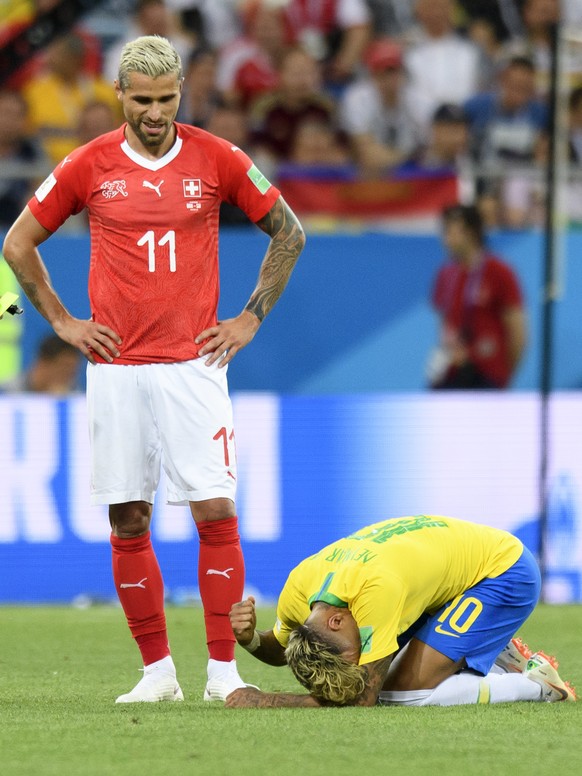 Switzerland&#039;s midfielder Valon Behrami, left, reacts next to Brazil&#039;s forward Neymar, right, during the FIFA soccer World Cup 2018 group E match between Switzerland and Brazil at the Rostov  ...