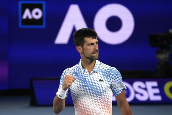 Novak Djokovic of Serbia reacts after winning a point against Andrey Rublev of Russia during their quarterfinal match at the Australian Open tennis championship in Melbourne, Australia, Wednesday, Jan ...