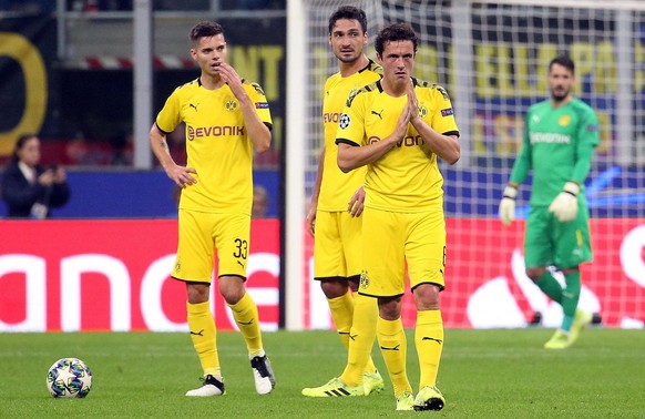 epa07944190 (L-R) Borussia Dortmund&#039;s Julian Weigl, Mats Hummels and Thomas Delaney react during the UEFA Champions League group F soccer match between FC Inter and Borussia Dortmund at the Giuse ...