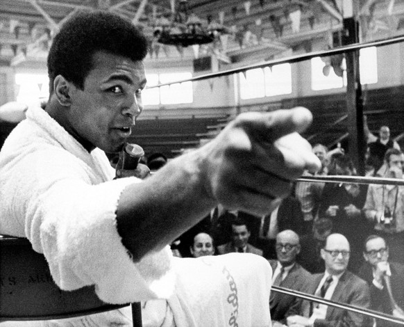 Heavyweight boxer Muhammad Ali makes a point during a news conference that he conducts from inside the ring in Atlanta, Ga., in this Oct. 24, 1970, photo. (AP Photo)