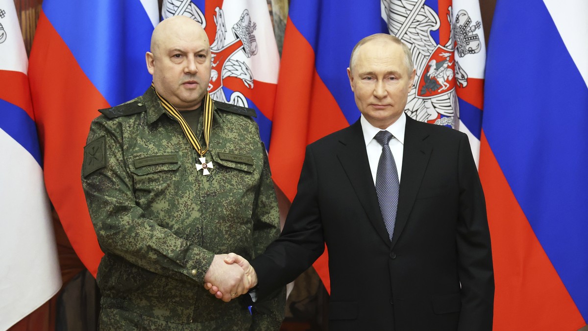 FILE - Russian President Vladimir Putin, right, shakes hands with commander of Russia's military operation in Ukraine General Sergei Surovikin, awarded with order of Saint George of the Third Cla ...