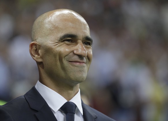 Belgium coach Roberto Martinez smiles as he waits for the start of the quarterfinal match between Brazil and Belgium at the 2018 soccer World Cup in the Kazan Arena, in Kazan, Russia, Friday, July 6,  ...