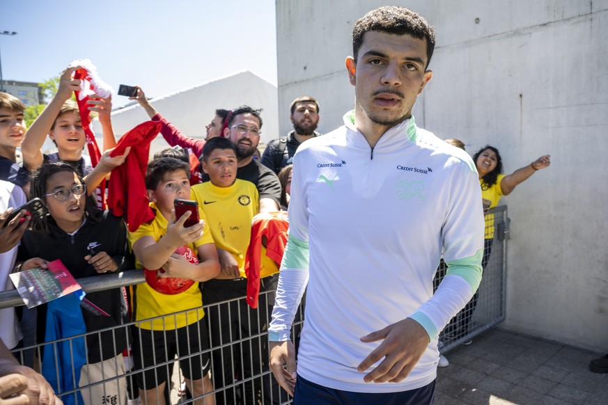 Switzerland&#039;s forward Zeki Amdouni signs autographs after a public training session of the Switzerland&#039;s national soccer team, after the UEFA Nations League group A2 soccer match between Swi ...
