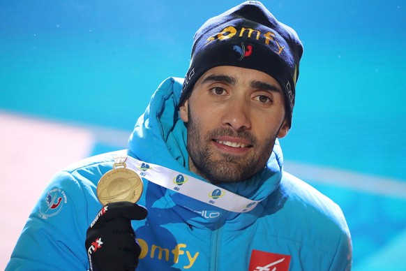 epa08229017 Winner Martin Fourcade of France pose on the podium during the medal ceremony for the mens 20km Individual race at the IBU Biathlon World Championships in Antholz/Anterselva, Italy, 19 Feb ...