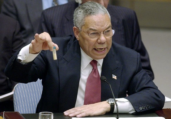 FILE - In this Feb. 5, 2003 file photo, Secretary of State Colin Powell holds up a vial he said could contain anthrax as he presents evidence of Iraq&#039;s alleged weapons programs to the United Nati ...