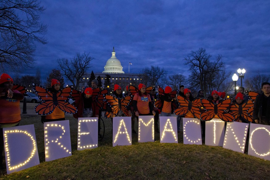 Demonstrators rally in support of Deferred Action for Childhood Arrivals (DACA) outside the Capitol, Sunday, Jan. 21, 2018, in Washington, on the second day of the federal shutdown. Democrats have bee ...