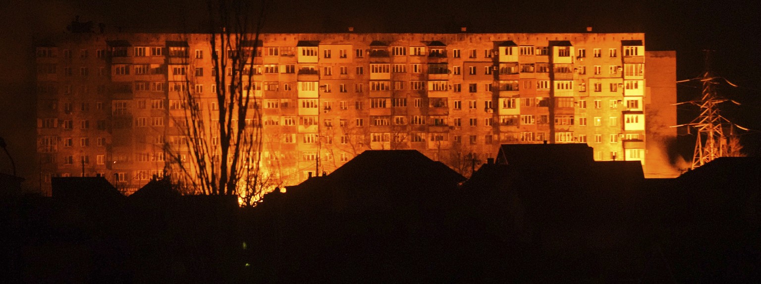 A fire is seen in a settlement area after shelling in Mariupol, Ukraine, Friday, March 4, 2022. (AP Photo/Evgeniy Maloletka)