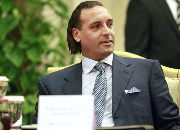 epa05065767 (FILE) A June 30, 2010 file photo shows Hannibal Gaddafi, son of the late Libyan leader Muammar Gaddafi, watching at a ceremony in Tripoli, Libya.  According to media reports,...