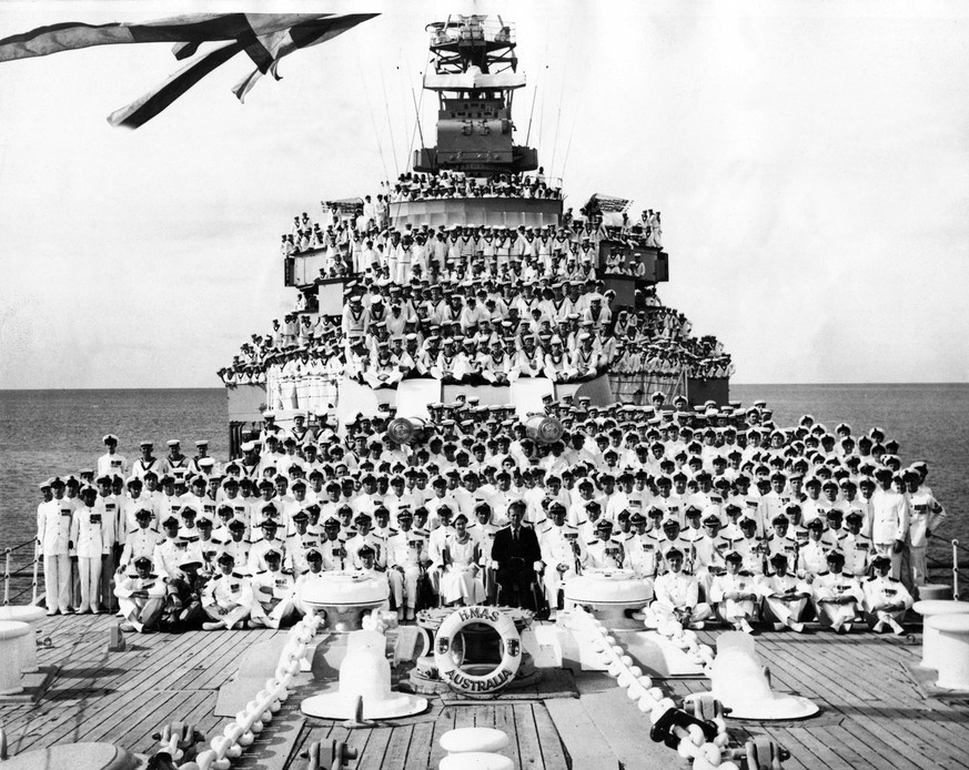 Queen Elizabeth II and Prince Philip pictured with the ships company on the HMAS Australia during their visit to Cairns, North Queensland, during the Royal Tour of the Commonwealth