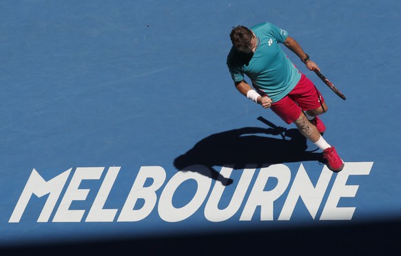 Switzerland&#039;s Stan Wawrinka walks along the back of the court while playing Italy&#039;s Andreas Seppi during their fourth round match at the Australian Open tennis championships in Melbourne, Au ...