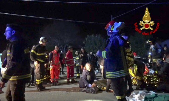 In this frame taken from video rescuers assist injured people outside a nightclub in Corinaldo, central Italy, early Saturday, Dec. 8, 2018. At least Six people, all but one of them minors, were kille ...