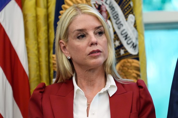 Attorney General Pam Bondi listens as President Donald Trump signs a presidential memorandum on the death penalty in the District of Columbia in the Oval Office at the White House, Thursday, Sept. 25, ...