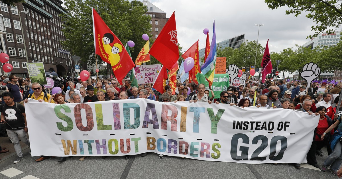 epa06075501 Protesters attend the 'Unlimited solidarity instead of G20' demonstration during the G-20 summit in Hamburg, Germany, 08 July 2017. The G20 Summit (or G-20 or Group of Twenty) is ...