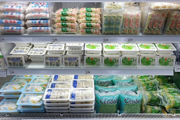PENANG, MALAYSIA - 21 JULY 2021: Interior view of the huge refrigerator with various choice fresh tofu, processed food in Giant grocery store, Penang. Giant is a trusted supermarket brand in Malaysia.