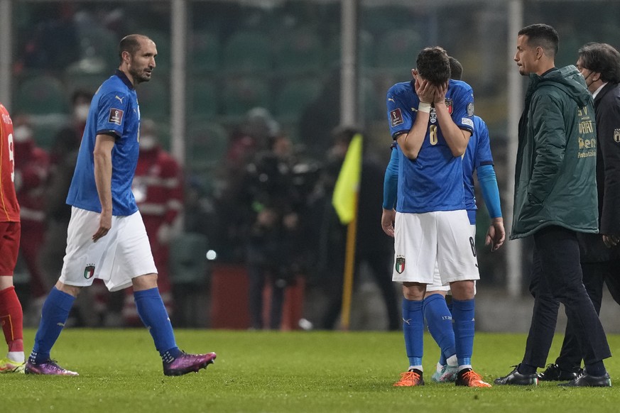 Italy&#039;s Jorginho, right, cries as his teammate walks after their team&#039;s got eliminated in the World Cup qualifying play-offsoccer match between Italy and North Macedonia, at Renzo Barbera st ...