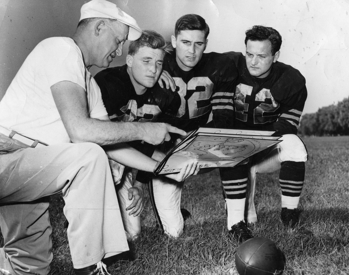 January 19, 2015, Chicago, IL, USA: George Halas, left, owner and coach of the Chicago Bears, explains diagramed plays to his quarterbacks Bobby Layne, left, Johnny Lujack and Sid Luckman on Sept. 3,  ...