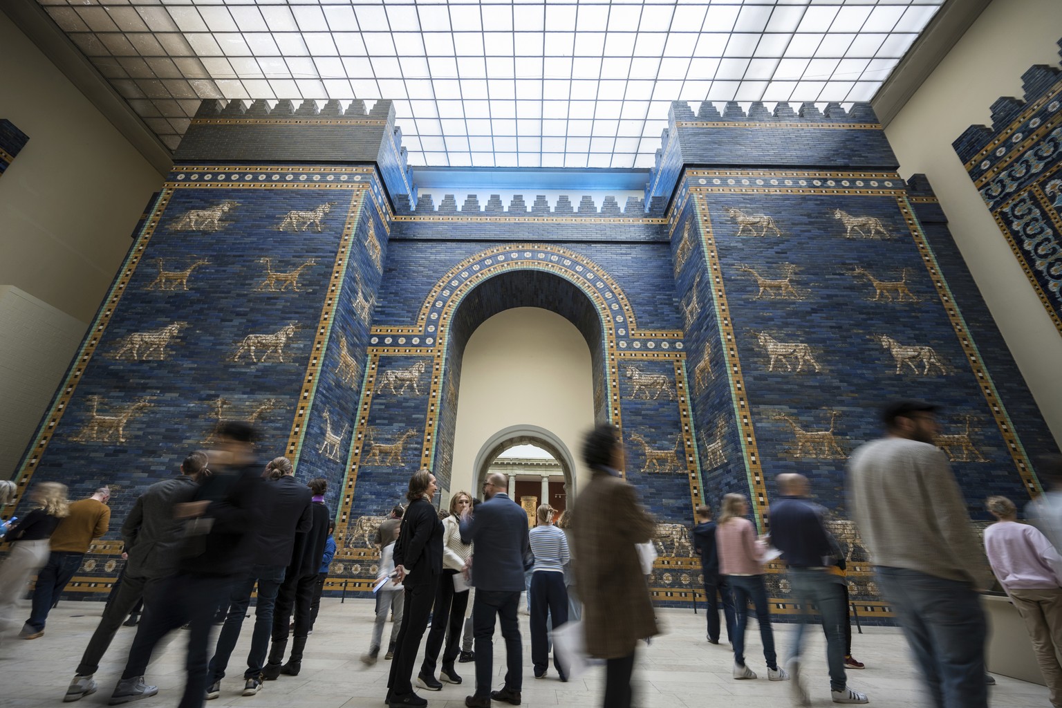 Visitors in front of Ishtar Gate of Babylon at Pergamon Museum in Berlin, Tuesday, April 4, 2023. A new light and sound installation by British contemporary artist Liam Gillick, part of the show Filte ...