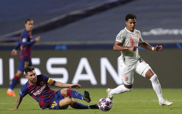 epa08604380 Lionel Messi (L) of Barcelona in action against Serge Gnabry of Bayern Munich during the UEFA Champions League quarter final match between Barcelona and Bayern Munich in Lisbon, Portugal, ...