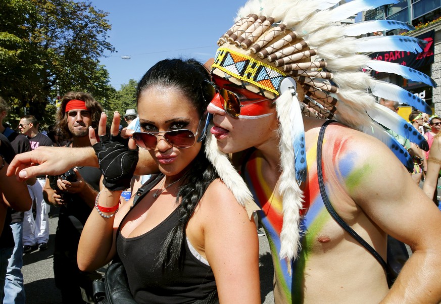 Revellers pose during the 24th Street Parade dance music event in Zurich August 29, 2015. REUTERS/Arnd Wiegmann