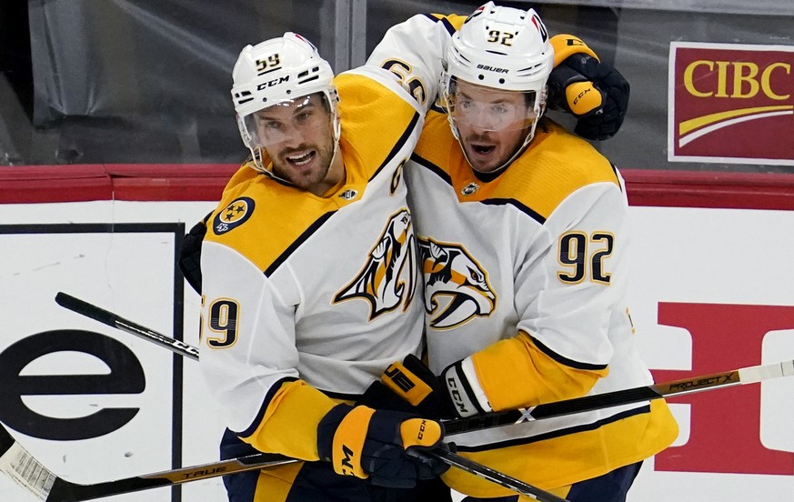 Nashville Predators defenseman Roman Josi, left, celebrates with center Ryan Johansen after scoring a goal during the third period of an NHL hockey game against the Chicago Blackhawks in Chicago, Sund ...