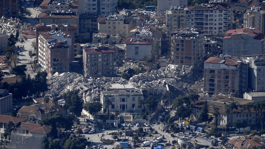 Collapsed buildings are seen in Antakya, southern Turkey, Wednesday, Feb. 8, 2023. Nearly two days after the magnitude 7.8 quake struck southeastern Turkey and northern Syria, thinly stretched rescue  ...