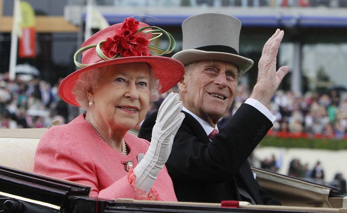 FILE - In this Thursday, June, 16, 2011 file photo Britain's Queen Elizabeth II with Prince Philip arrive by horse drawn carriage in the parade ring on the third day, traditionally known as Ladie ...