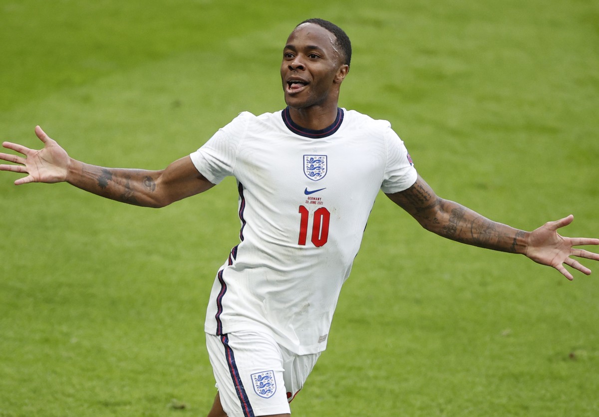 England's Raheem Sterling celebrates after scoring his side's opening goal during the Euro 2020 soccer match round of 16 between England and Germany at Wembley stadium in London, Tuesday, Ju ...