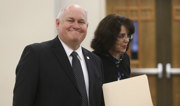 FILE - In this April 1, 2017 file photo, Republican GOP congressional candidate in the 4th district Ron Estes votes with his wife Susan Estes at Holy Cross Lutheran Church in Wichita, Kan. Republicans ...