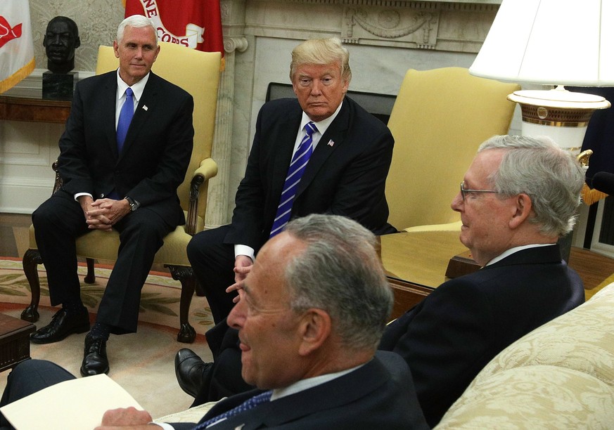epa06188131 US Vice President Mike Pence (L) and US President Donald J. Trump (C-back) meet with Senate Majority Leader Senator Mitch McConnell (R), Senate Minority Leader Senator Chuck Schumer (C-fro ...