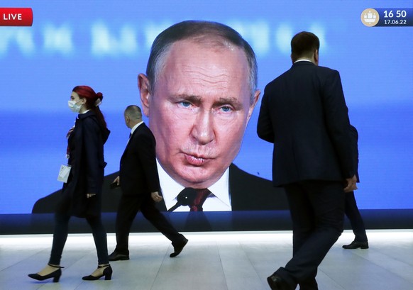 epa10481397 (FILE) - A large screen shows Russian President Vladimir Putin at the plenary session of the St. Petersburg International Economic Forum (SPIEF) in St. Petersburg, Russia, 17 June 2022 (re ...