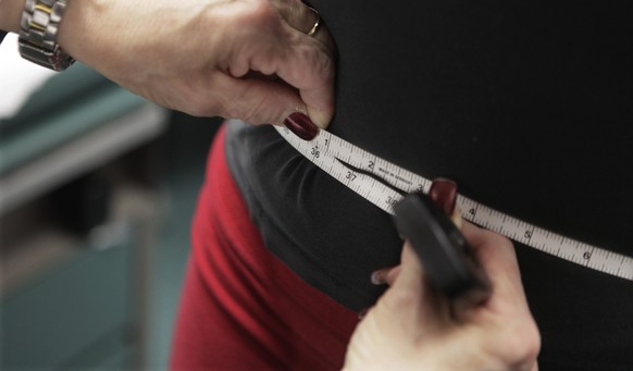 FILE - In this Jan. 20, 2010, file photo, a waist is measured during an obesity prevention study in Chicago. A study published Wednesday, April 5, 2017 in the New England Journal of Medicine suggests  ...