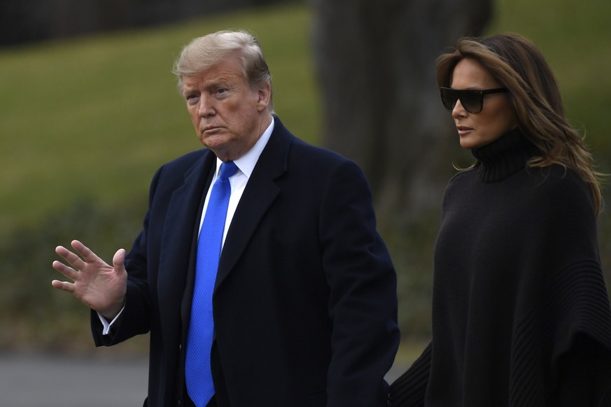 President Donald Trump and first lady Melania Trump walk to Marine One on the South Lawn of the White House in Washington, Friday, Feb. 15, 2019, for the short trip to Andrews Air Force Base, Maryland ...