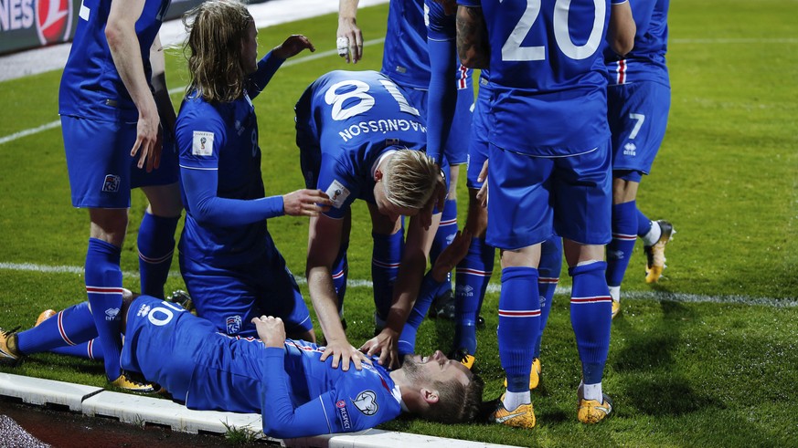 Iceland&#039;s players celebrate after scoring against Kosovo, during the World Cup Group I qualifying soccer match between Iceland and Kosovo in Reykjavik, Iceland, Monday Oct. 9, 2017. (AP Photo/Bry ...