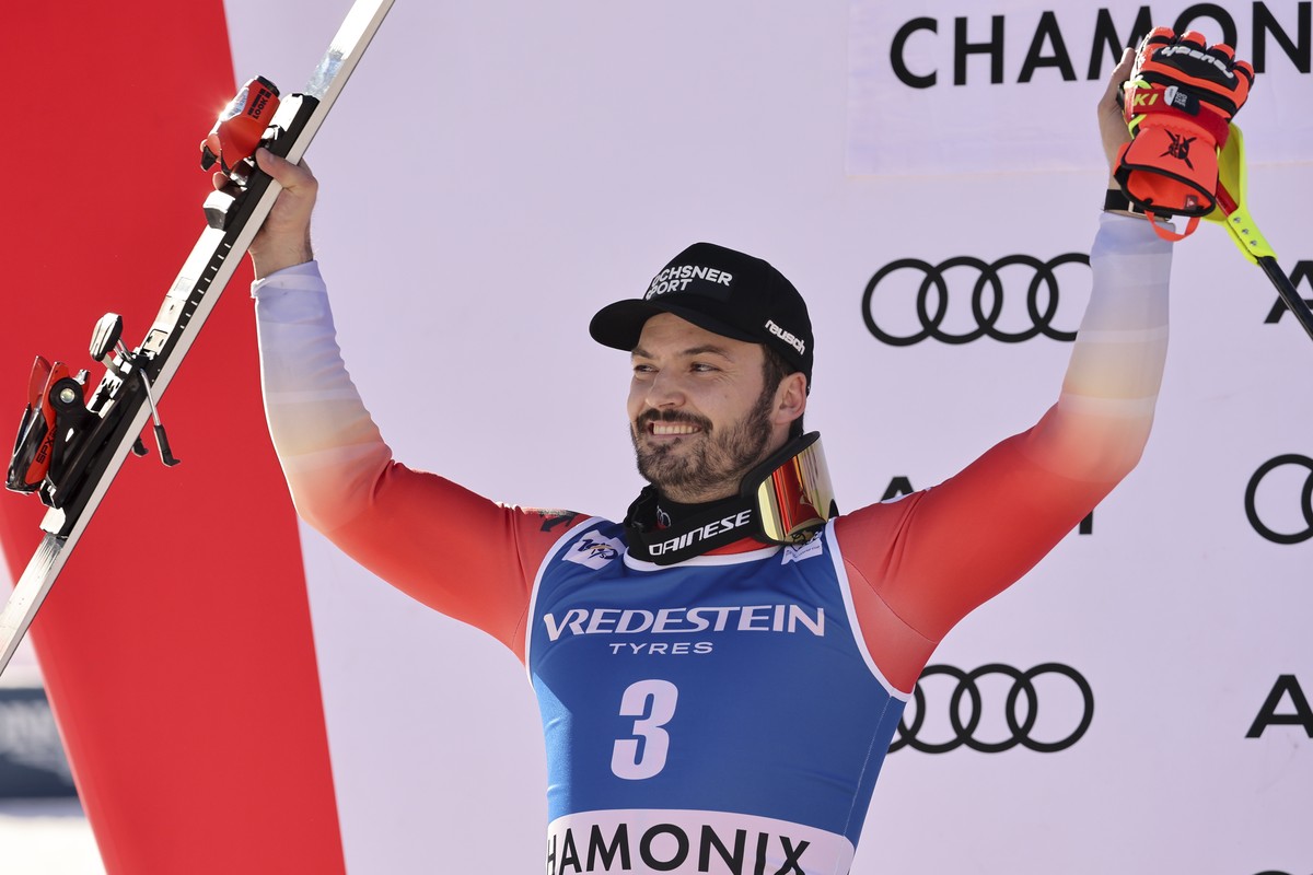 Switzerland's Loic Meillard celebrates on the podium after taking second place in an alpine ski, men's World Cup slalom race, in Chamonix, France, Sunday, Feb. 4. 2024. (AP Photo/Marco Trova ...
