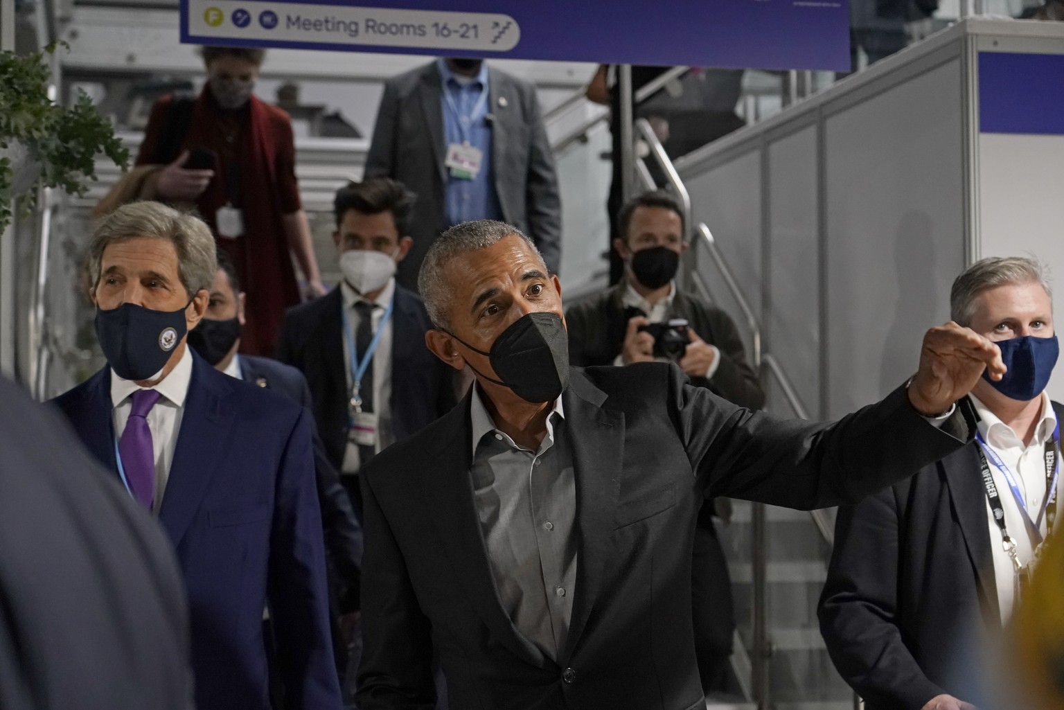 Former U.S. President Barack Obama is accompanied by John Kerry, United States Special Presidential Envoy for Climate, left, as he arrives at an event during the COP26 U.N. Climate Summit in Glasgow,  ...