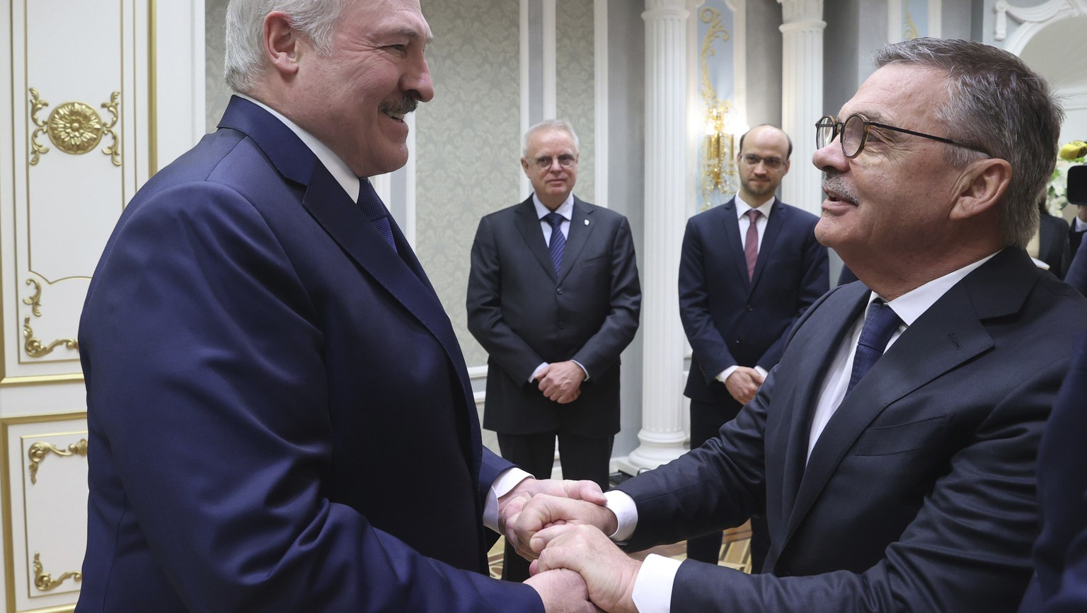 Belarusian President Alexander Lukashenko, left, greets International Ice Hockey Federation President Rene Fasel during their meeting in Minsk, Belarus, Monday, Jan. 11, 2021. (Nikolai Petrov/BelTA Po ...