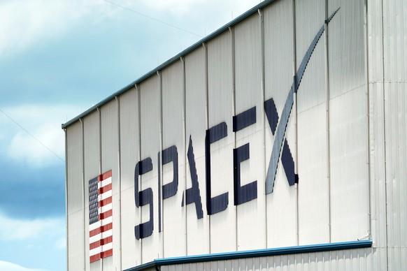 FILE - A SpaceX logo is displayed on a building, May 26, 2020, at the Kennedy Space Center in Cape Canaveral, Fla. (AP Photo/David J. Phillip, File)
Space X,Falcon 9