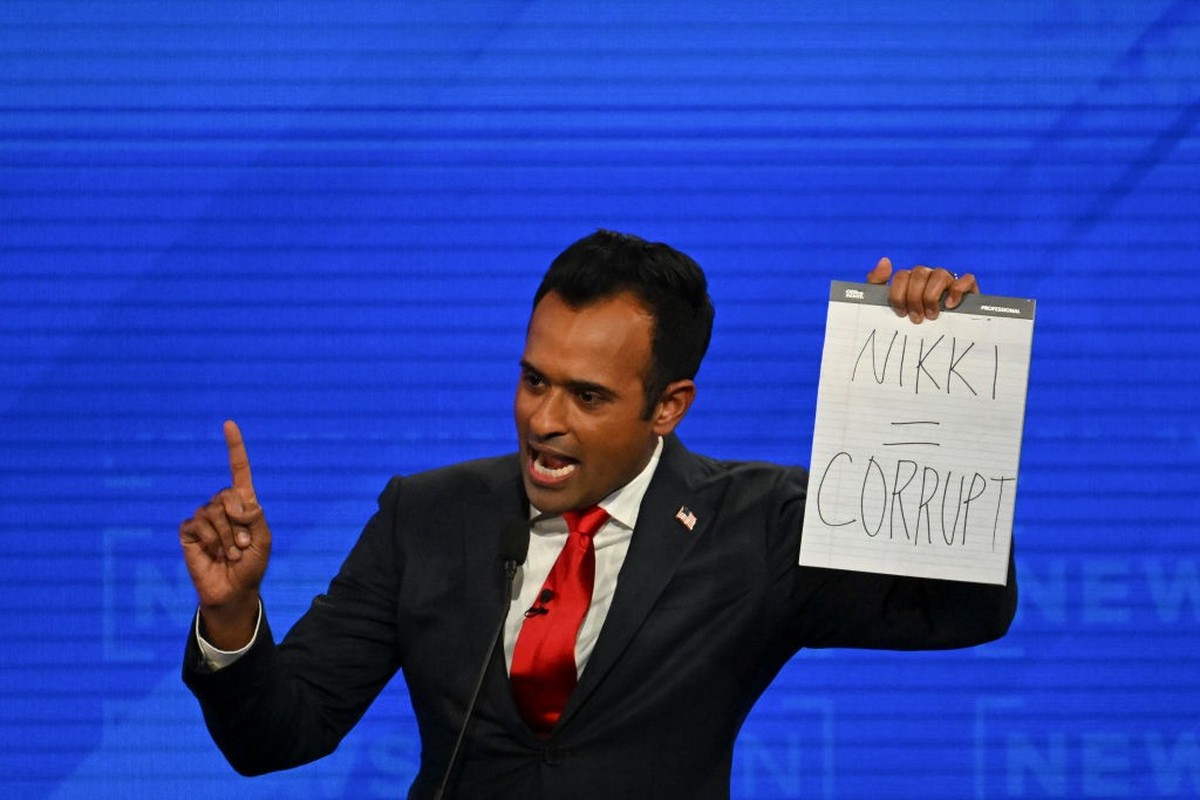 TUSCALOOSA, AL- DECEMBER 6: Republican presidential candidate businessman Vivek Ramaswamy holds up a sign about former United Nations Ambassador Nikki Haley during the NewsNation Republican Primary De ...