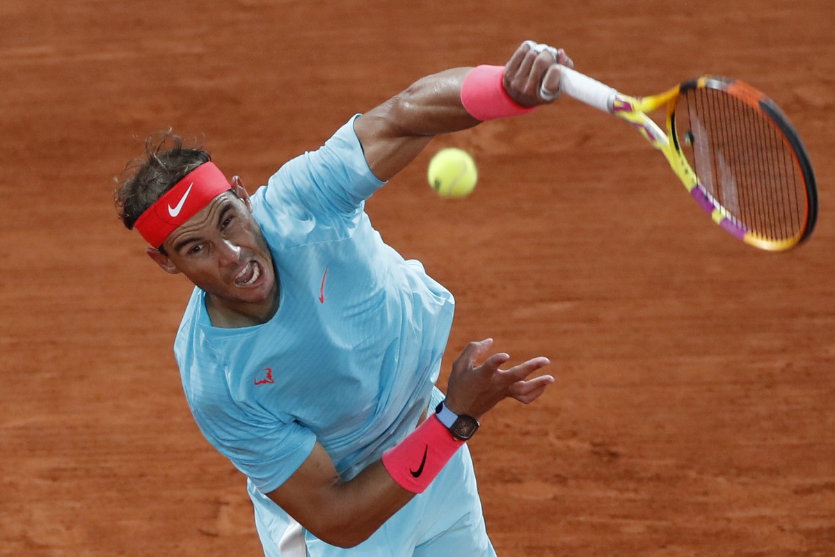FILE - In this Oct. 11, 2020, file photo, Spain's Rafael Nadal serves against Serbia's Novak Djokovic in the final match of the French Open tennis tournament at the Roland Garros stadium in  ...