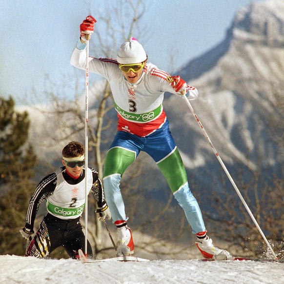 Switzerland?s Hippolyt Kempf races ahead of West Germany?s Hubert Schwarz in the Nordic combined 15km event to win the last gold medal in the Olympic Games in Canmore on Sunday, Feb. 28, 1988. (AP Pho ...