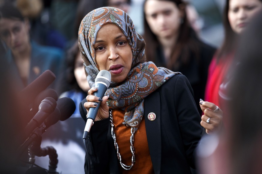 epa07351074 Democratic Representative from Minnesota Ilhan Omar delivers remarks during a press conference on deportation at Capitol Hill in Washington, DC, USA, 07 February 2019. During the press con ...