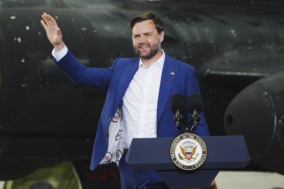 U.S. Vice President JD Vance, wearing a jacket lined in material printed with his vice presidential seal of office and his initials, speaks during a visit to airmen and family members of the 501st com ...