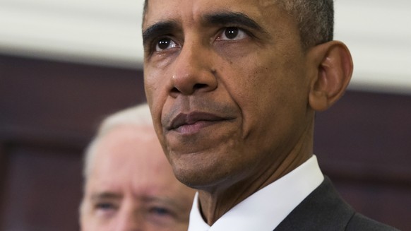 FILE - In this Feb. 11, 2015, file photo, Vice President Joe Biden listens at left, as President Barack Obama speaks about the Islamic State group in the Roosevelt Room of the White House in Washingto ...