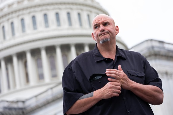 epa12418649 Senator John Fetterman, a Democrat from Pennsylvania, reacts at the US Capitol, in Washington, DC USA, 30 September 2025. Democrat and Republican leadership are taking part in negotiations ...