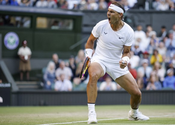 epa10052390 Rafael Nadal of Spain reacts during the 4th round match against Botic Van De Zandschulp of the Netherlands at the Wimbledon Championships, in Wimbledon, Britain, 04 July 2022. EPA/TOLGA AK ...