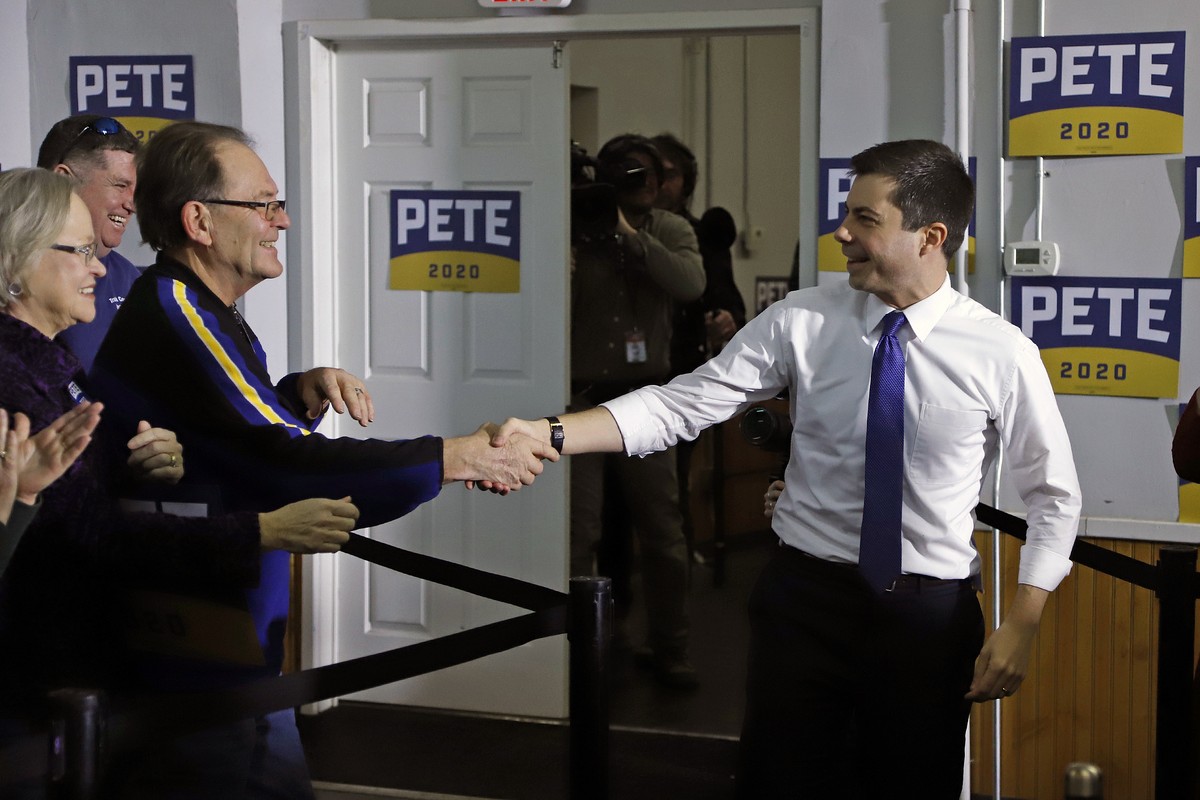 Democratic presidential candidate, former South Bend, Ind., Mayor Pete Buttigieg, right, arrives at a town hall meeting at the Lake Cooper Foundation in Keokuk, Iowa, Tuesday, Jan. 21, 2020. (AP Photo ...