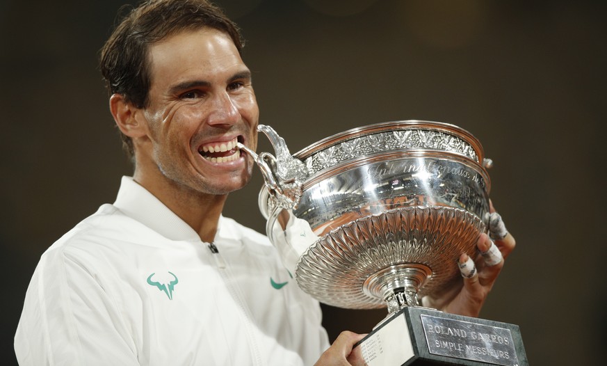 epa08736069 Rafael Nadal of Spain holds his trophy after winning against Novak Djokovic of Serbia in their men?s final match during the French Open tennis tournament at Roland ?Garros in Paris, France ...