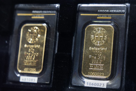 Gold bars made by Swiss gold refinery Argor-Heraeus are seen on display in Bern, Switzerland, Friday, August 8, 2025. Since Thursday, 7 August, additional tariffs of 39 per cent have been imposed on g ...